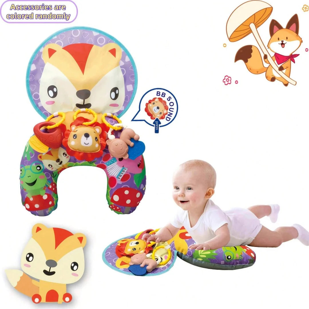 A baby is playing on a colorful tummy time pillow mat with attached rattle toys and accessories.