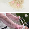Close-up of a pink sheer fabric sleeve with a pink bow detail being sewn onto it.