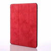 A red Retro Marble iPad Pro 12.9 case with a built-in pencil holder.