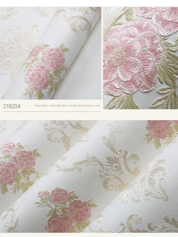 Close-up of pink and green floral wallpaper featuring detailed carved designs on a white background.