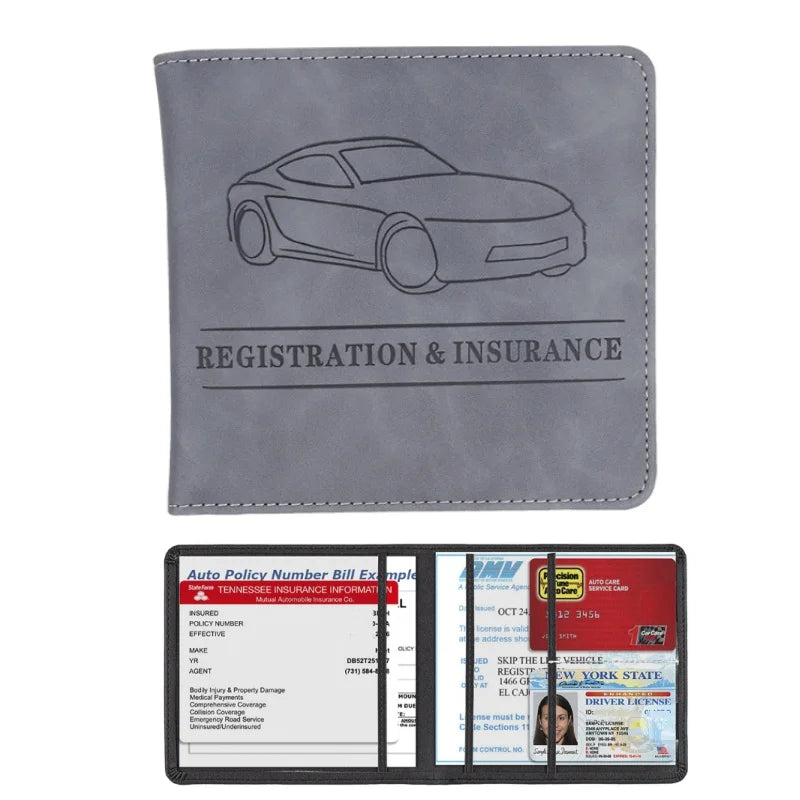 A gray leather card holder wallet featuring a silhouette of a car and text for registration and insurance documents.