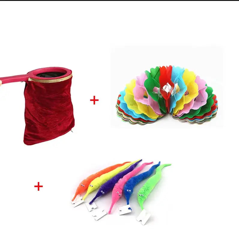 A set of magic trick props including a red velvet bag, a colorful flower, and several colored plastic tubes.