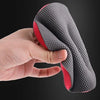 A hand is holding a gray reusable car wash magic clay pad with red accents.
