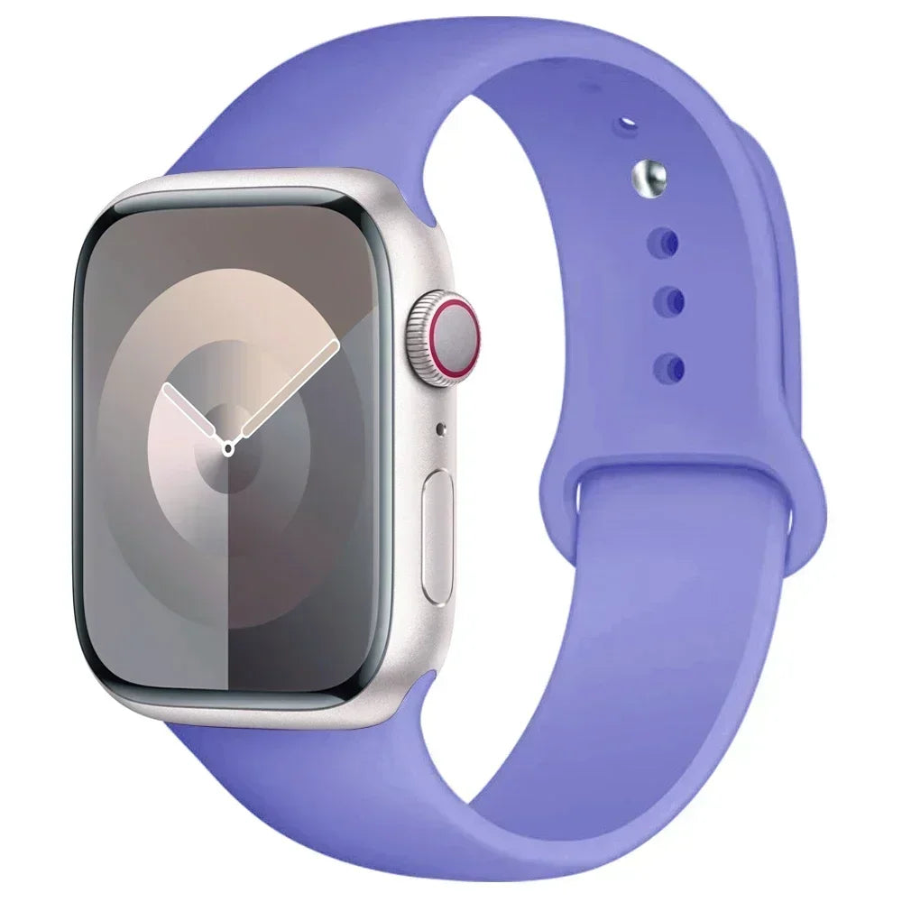 A silver Apple Watch is shown attached to a purple silicone sport band.