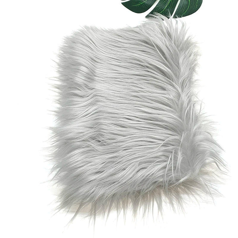 A fluffy silver faux fur fabric used for DIY sewing, doll hair, and cosplay.