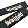 Black nylon keychain with white embroidered text WANTED and yellow stars on a black background