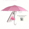A pink UV-blocking phone sunshade with an adjustable suction cup stand is shown above a smartphone.