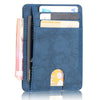 A dark blue slim leather wallet with multiple cards and a signature embossed on the front.