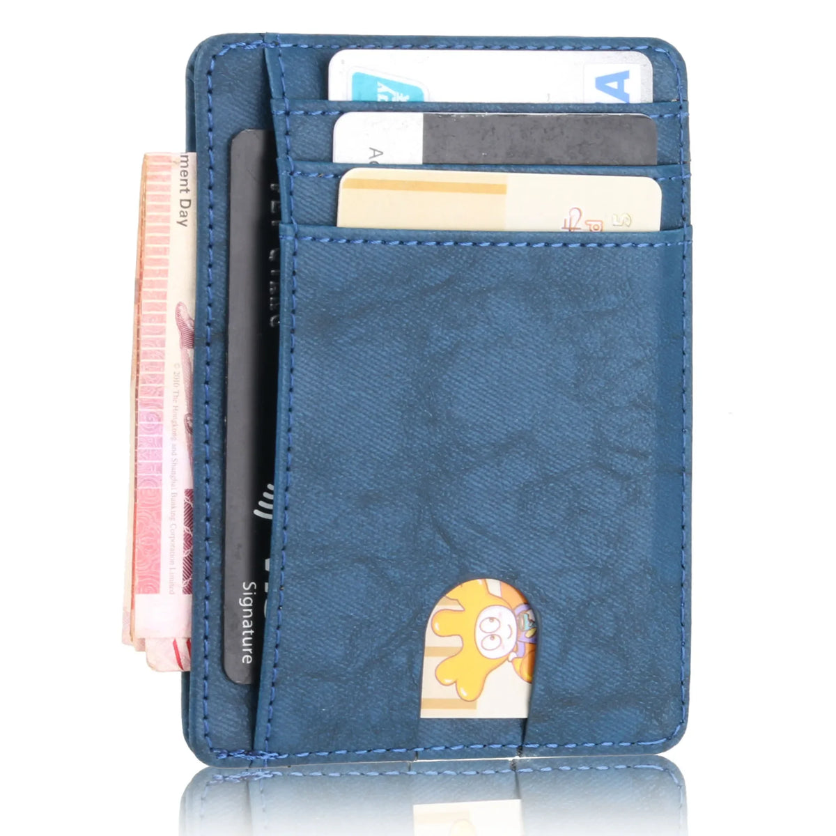 A dark blue slim leather wallet with multiple cards and a signature embossed on the front.
