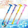 Five colorful foam water blaster toys with multi-hole spray nozzles floating in clear blue water.