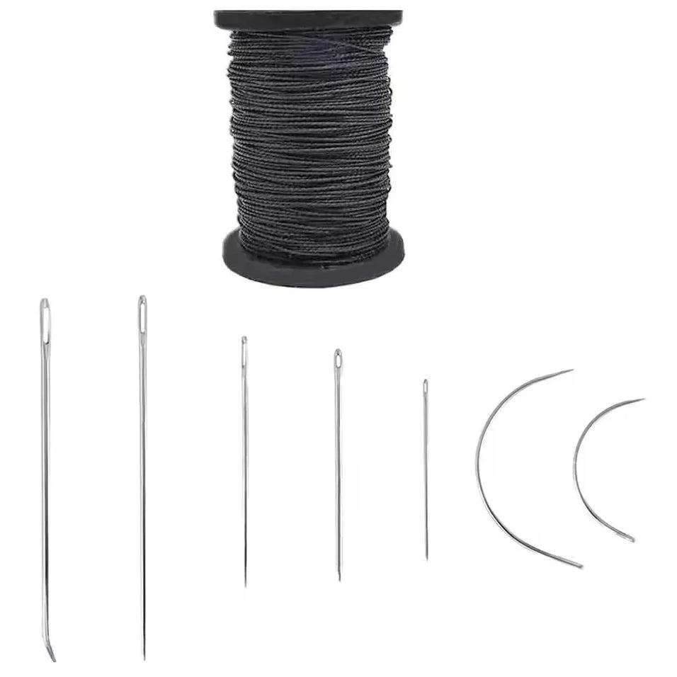 A spool of black waxed thread and various leather sewing needles.