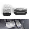 Two black aluminum non-slip pedal covers for a car, showing the top and bottom views.