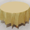 A round table covered with a light yellow or beige disposable tablecloth.