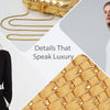 A woman models a white top and black blazer next to gold woven clutch bags and fabric details.