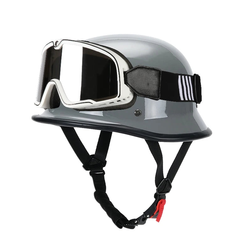 A gray lightweight half helmet with integrated goggles is shown for motorcycle and scooter riders.