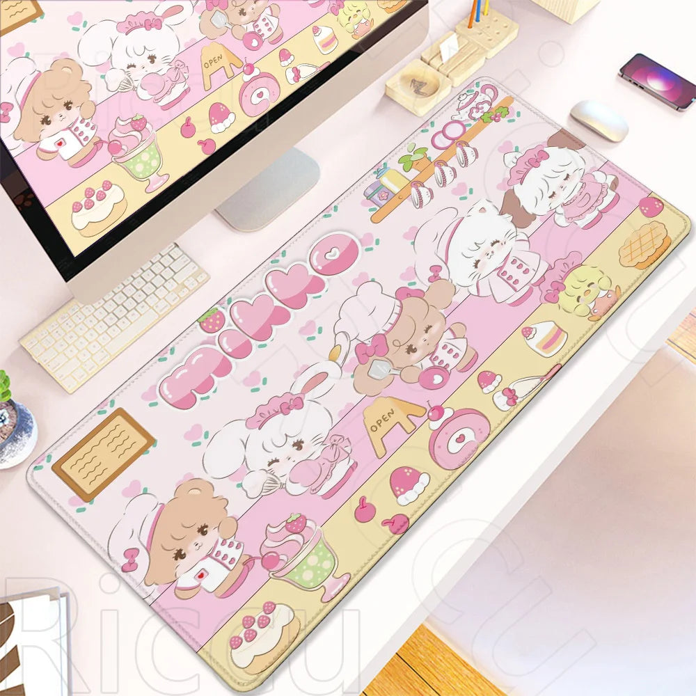 A pink and white kawaii cartoon gaming desk mat featuring cute characters and food items with a non-slip rubber base.