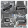 Carbon fiber grain trim cover for the center console of a Ford F-150 truck interior.