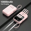 A pink 10000mAh portable power bank with built-in cables and a flashlight is shown lying on a dark surface.