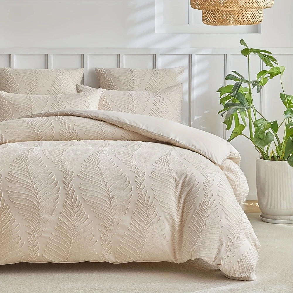 A beige embossed leaf pattern microfiber duvet cover set displayed on a bed with white headboard and natural light.