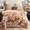 A beige weighted plush blanket featuring a floral pattern and reversible soft comfort.