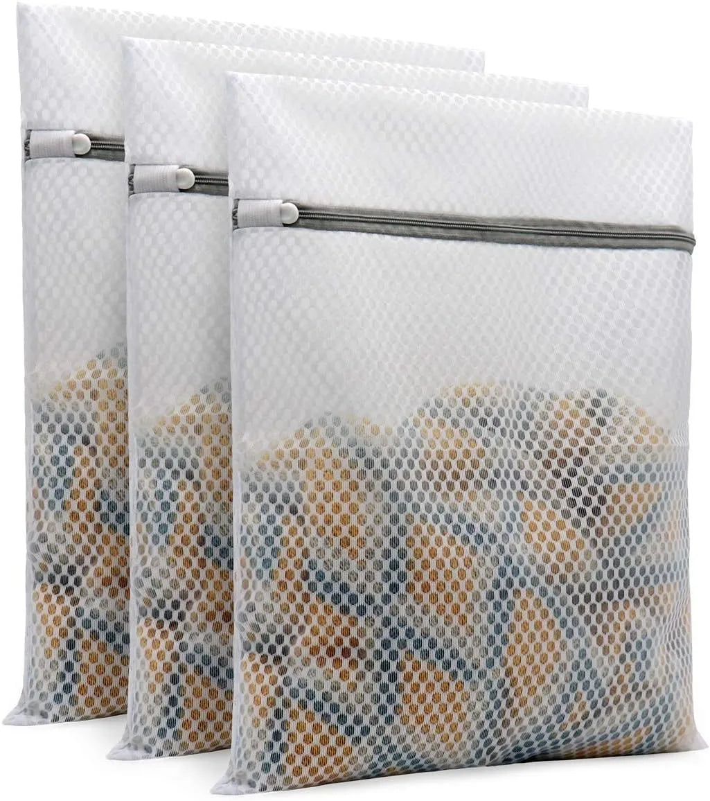 Set of three reusable mesh laundry bags filled with delicate items