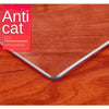 A package of Anti Cat furniture protective film is shown on a wooden surface.