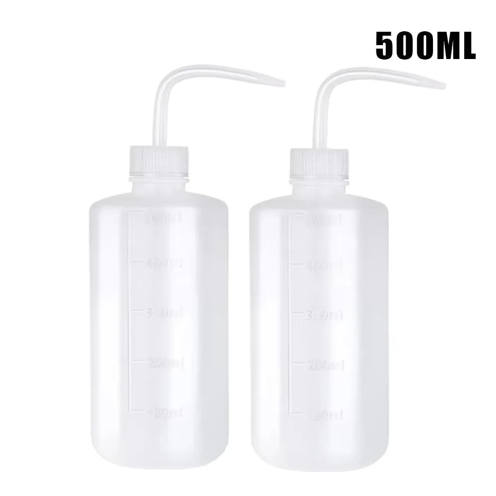 Two clear 500ml tattoo squeeze bottles with precision tips
