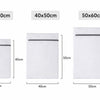 Three mesh laundry bags in sizes 30x40cm, 40x50cm, and 50x60cm shown side by side.