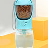 A light blue pet drinking kettle with a silicone spout and a clear water bottle for dogs.