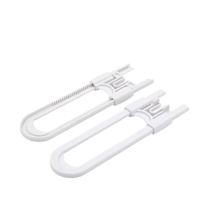 A pair of white adjustable U-shaped cabinet locks with a textured grip and mounting hardware.
