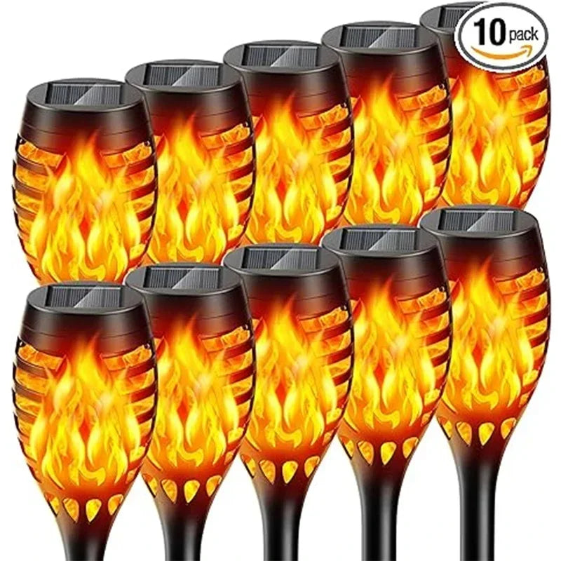 Ten pack of solar flame torch lights with glowing orange and yellow flames