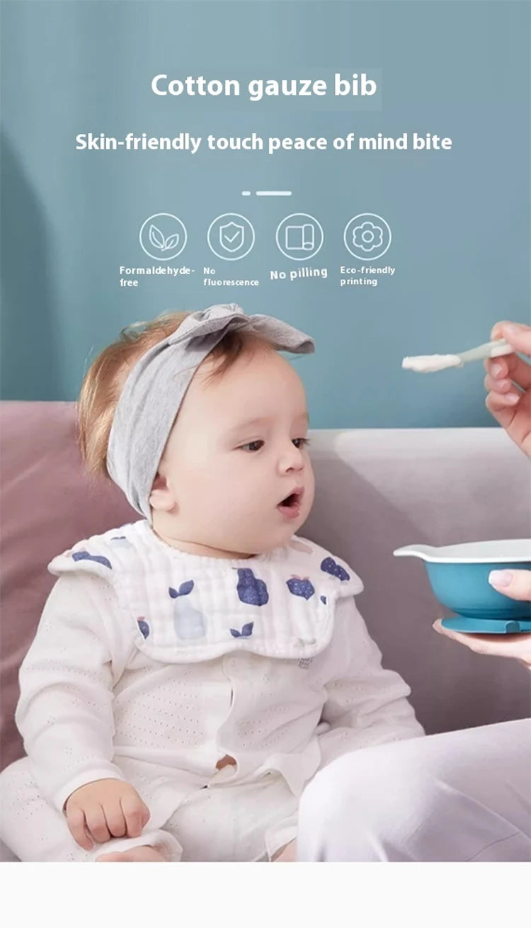 A baby wearing a light gray cotton gauze bib while sitting on a couch, with product features listed above.