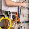 A person is holding a rotating tool belt hook for drills and work gear, showing various tools and accessories.