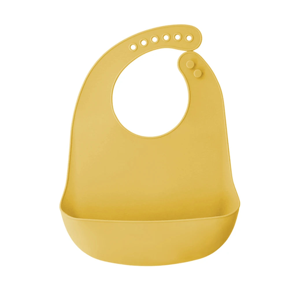 A yellow silicone baby bib with a catch pocket for feeding