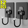 Twelve black adhesive hooks with metal clasps mounted on a gray wall.
