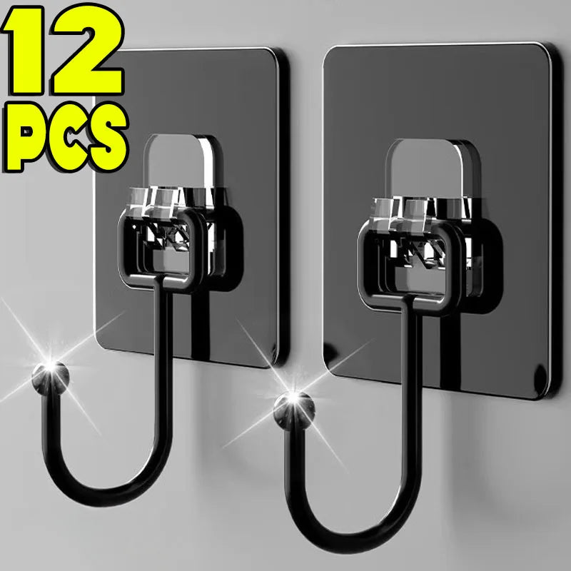 Twelve black adhesive hooks with metal clasps mounted on a gray wall.