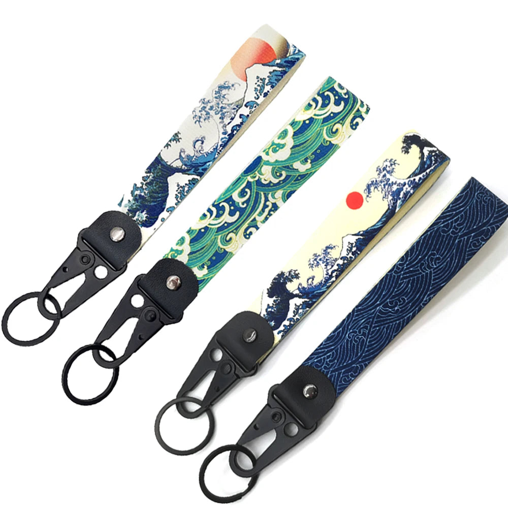 Hokkaido Wave JDM keychain featuring a Kanagawa surf design with blue and white patterns