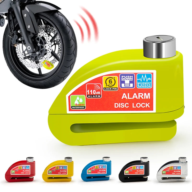 Un freno de disco amarillo con alarma y sensor de movimiento junto a varios candados de colores.