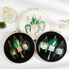 A set of floral cross stitch embroidery kits featuring green leaves and vines on white and black fabric.