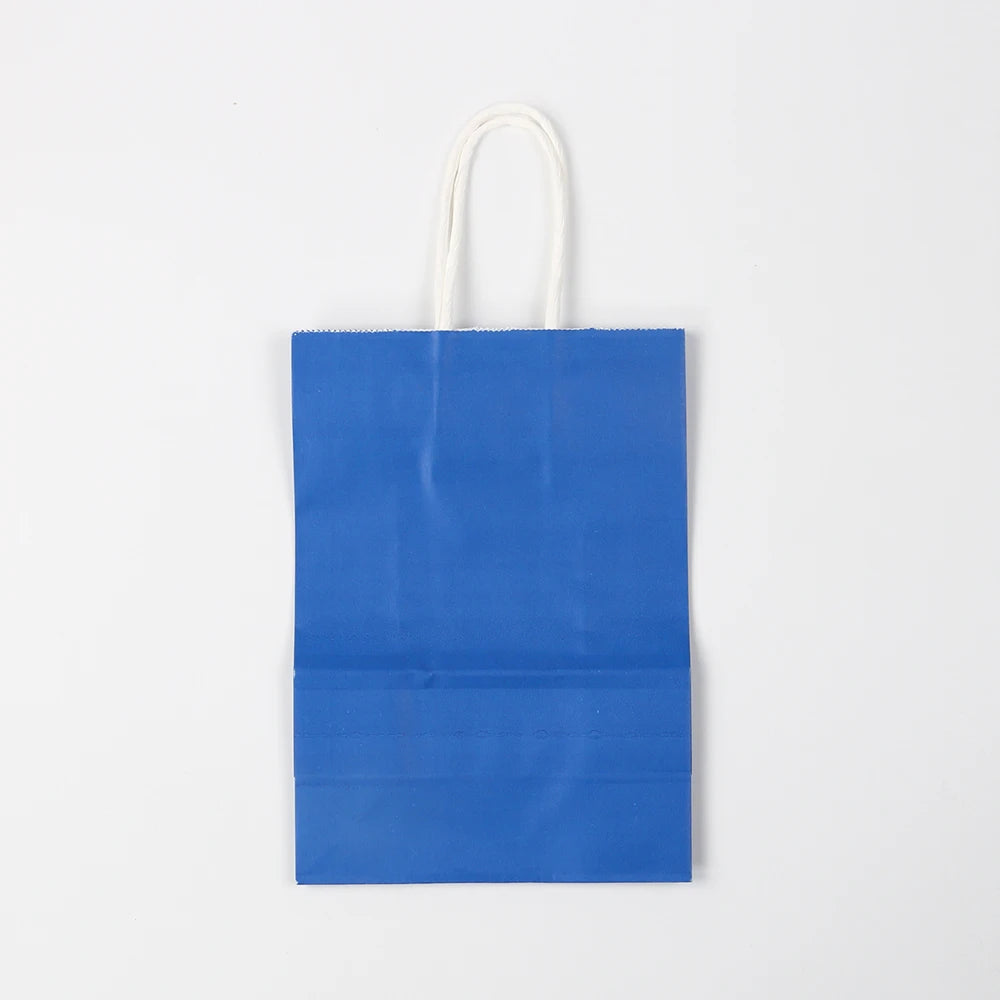 A plain blue paper gift bag with white handles.