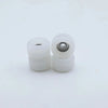 Two white urethane fingerboard wheels with visible bearings