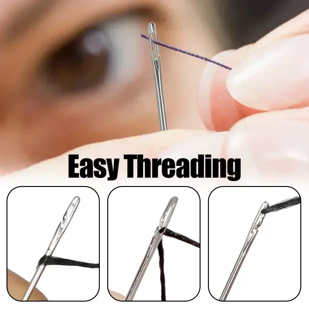 Close-up of a stainless steel self-threading sewing needle being used for hand sewing.