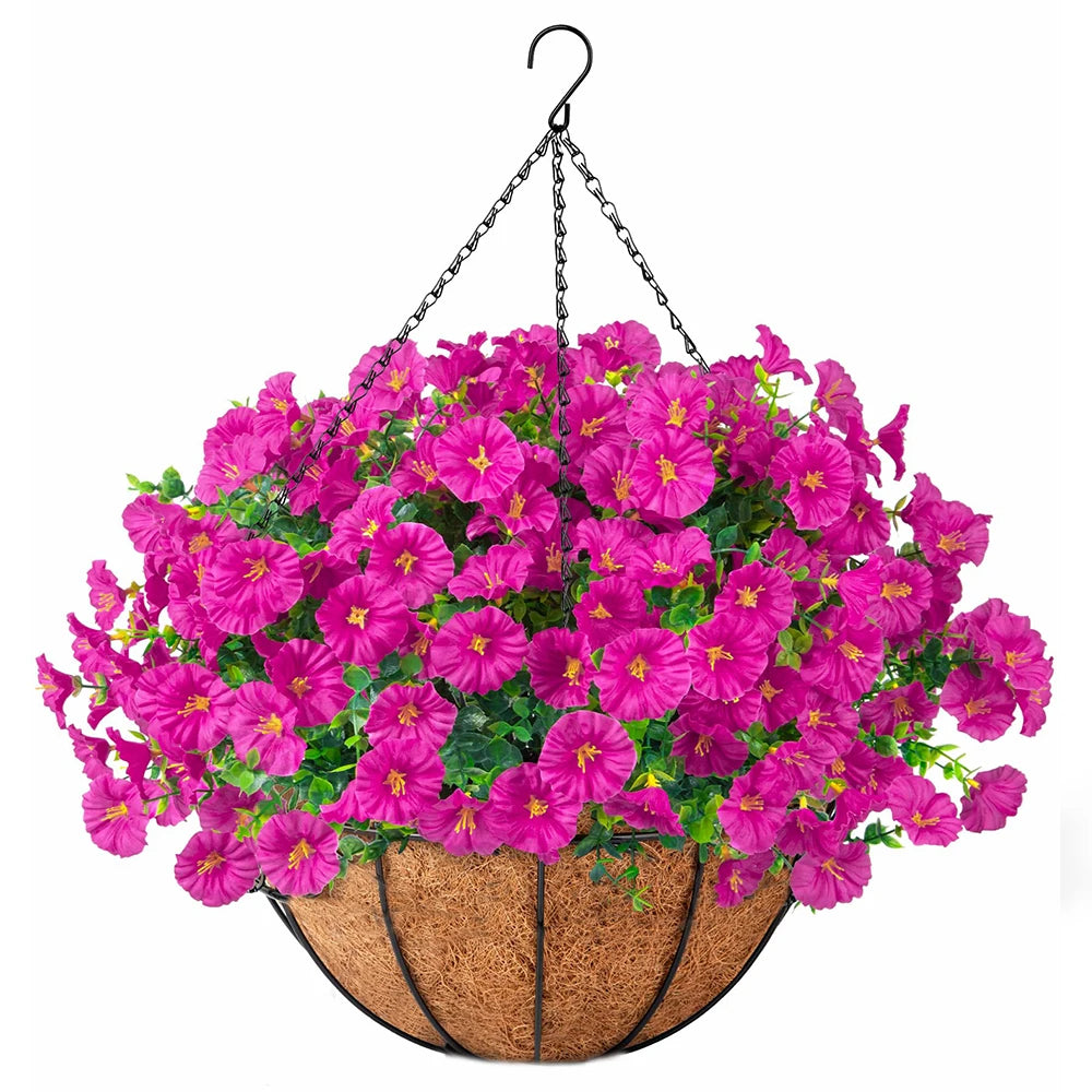 A vibrant arrangement of pink and magenta artificial morning glory flowers hanging from a black wire, displayed in a woven ba