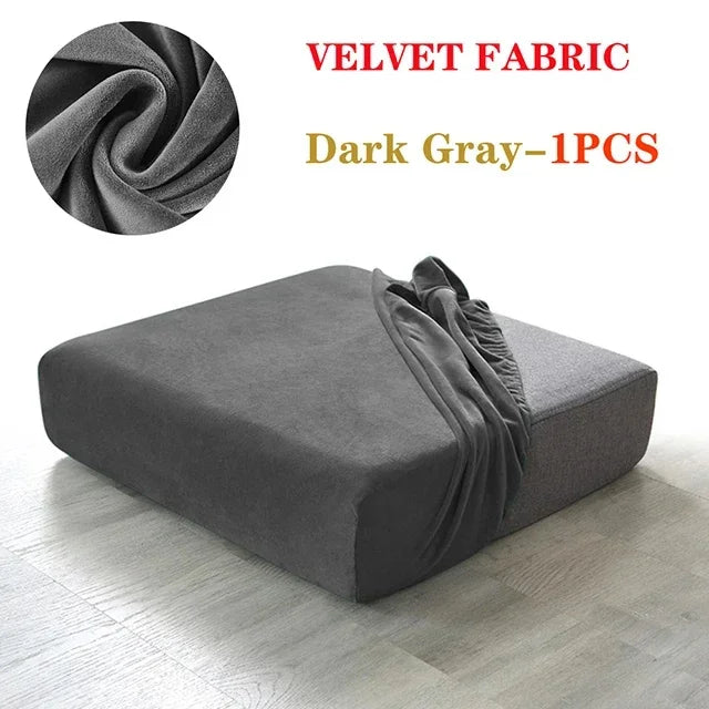 Dark gray velvet fabric sofa cover shown on a floor.