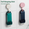 A close-up of a tail hanging hole tool used for convenient storage, featuring a teal and pink cleaning brush.