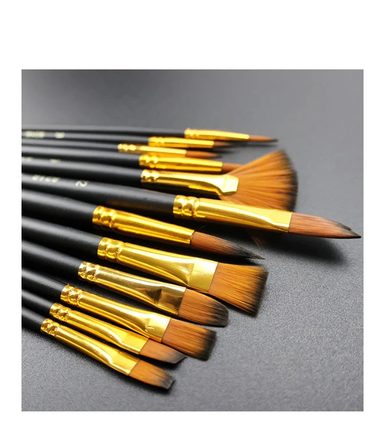 A collection of twelve black handles with gold ferrules and brown bristles for painting brushes.