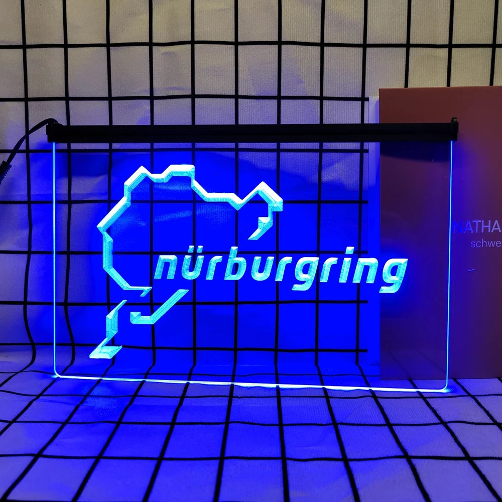 A bright blue neon sign shaped like the outline of Nuremberg is displayed against a grid background.