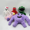 A collection of plush toys including a white rabbit, a red bird, a green dinosaur, and a purple monster.