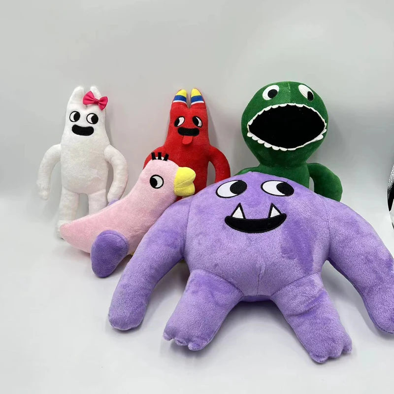 A collection of plush toys including a white rabbit, a red bird, a green dinosaur, and a purple monster.