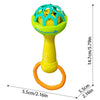 A yellow baby sensory spinning rattle toy with a green lattice top and an orange ring.
